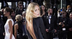 Slavna manekenka u Cannesu skoro otkrila previše haljinom visokog izreza