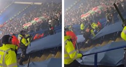 Policajac pao niz stepenice za vrijeme nereda na stadionu. Poljski huligani ga tukli