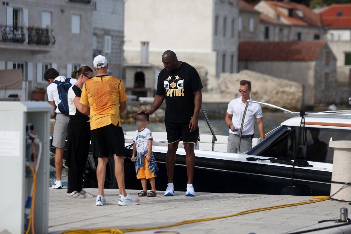 Magic Johnson posed for fan photos on the island of Vis