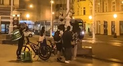 VIDEO Dostavljač palio LGBT zastavu u Zagrebu, drugi gurnuo curu koja se usprotivila