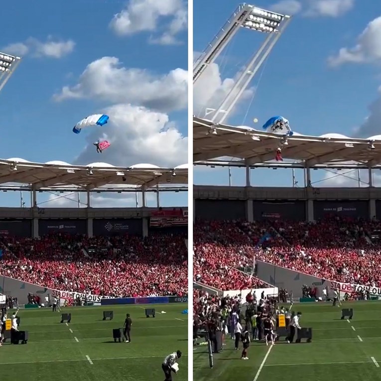 VIDEO Padobranac htio sletjeti na stadion. Zapeo je za krov i ostao visjeti