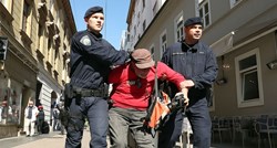 VIDEO Policija brutalno privela fotoreportera dok je Keleminec palio Novosti