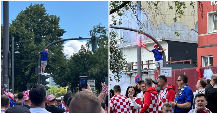 Hrvatski navijač popeo se na semafor u centru Hamburga pa zapalio baklju
