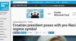 Predsjednica nas sramoti, agencija AFP objavila članak o Kolindinoj slici s ustaškom zastavom