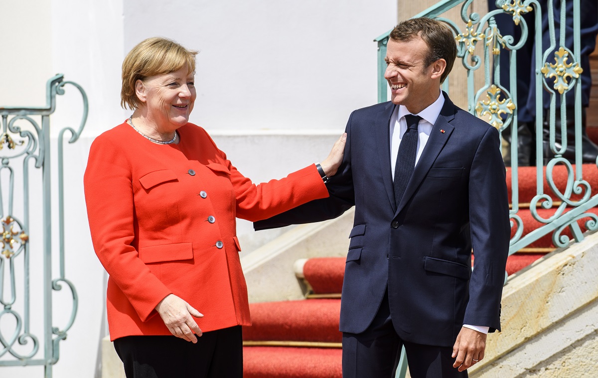 Macron i Merkel žele vraćati migrante u zemlje u kojima su ušli u EU