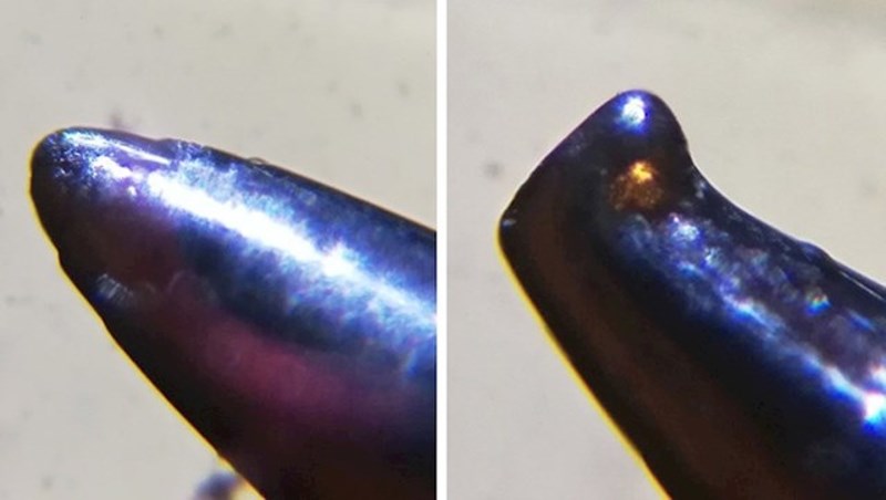 Uvećana slika nove i korištene igle za šivanje