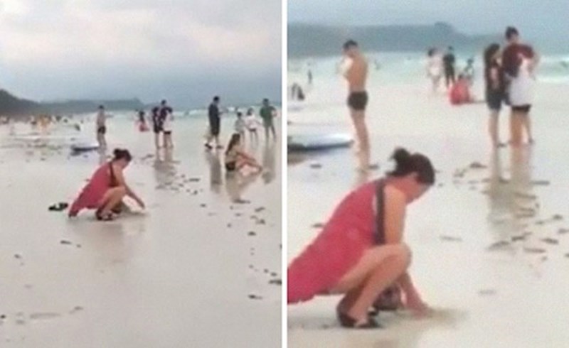 Ova žena je na plaži Boracay uočena kako zakopava u pijesak rabljenu pelenu