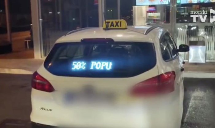 Prolaznik je na taksiju snimio bizarnu reklamu za akcijski popust, morate vidjeti kome ga vozač nudi