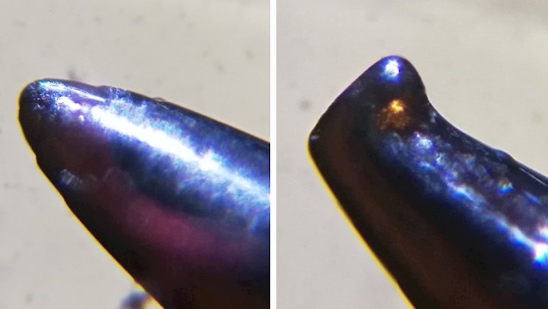 Uvećana slika nove i korištene igle za šivanje