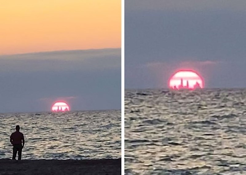 14. Neboderi u Chicagu vide se za vrijeme zalaska sunca na plaži u Indijani.