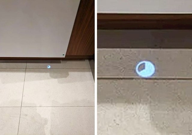 13. Perilica suđa projektira tajmer na podu.