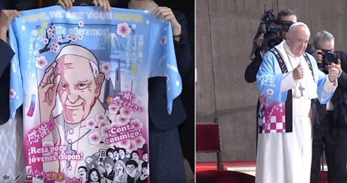 Papa nosi tradicionalni kaput sa slikom njegovog lica kako bi pozdravio Japance