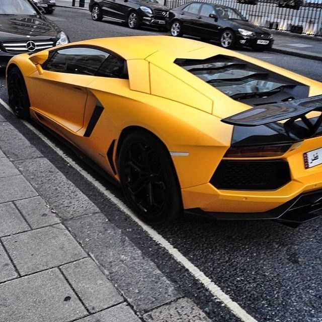 Awesome yellow Lamborghini on the street.
