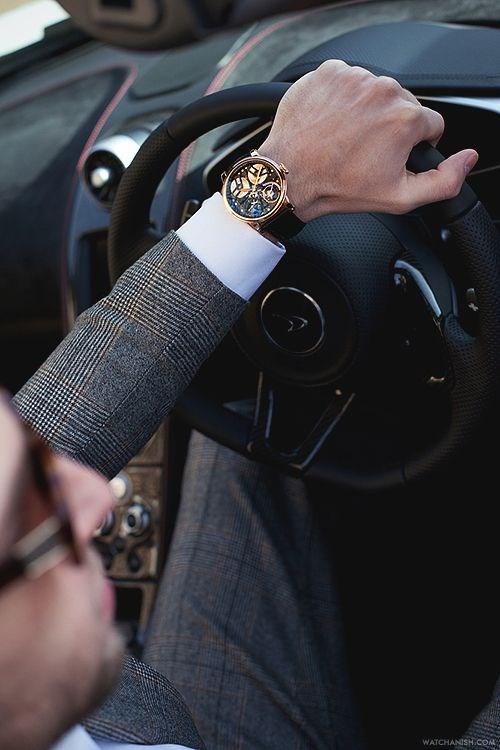 Arnold & Son TB88 Skeleton in rose gold and a McLaren car.