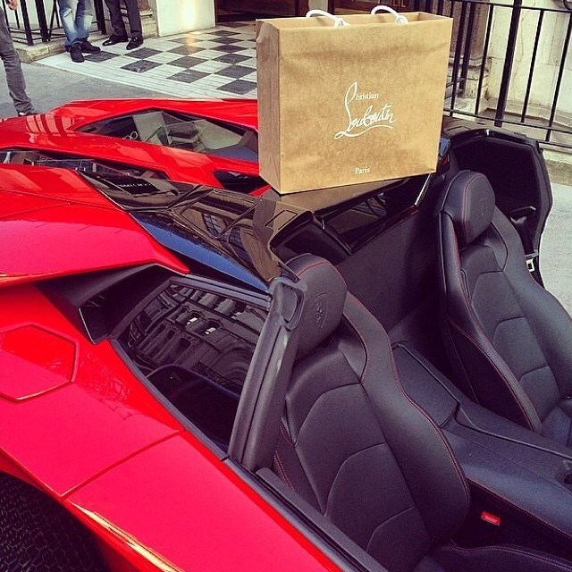 Red match. Red soles and a red supercar.