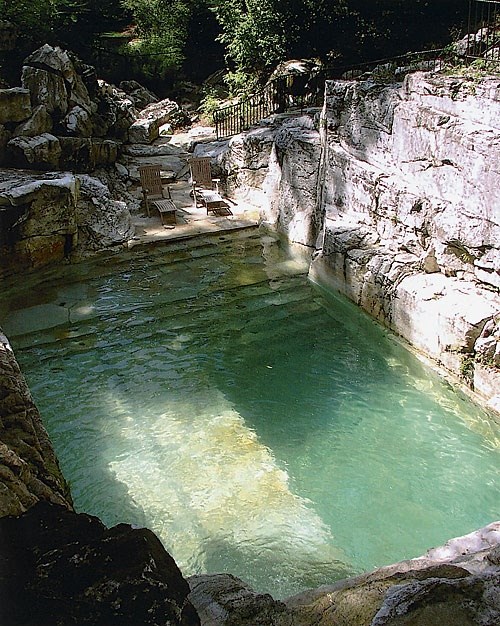Home with a pool built into a rock quarry...amazing!