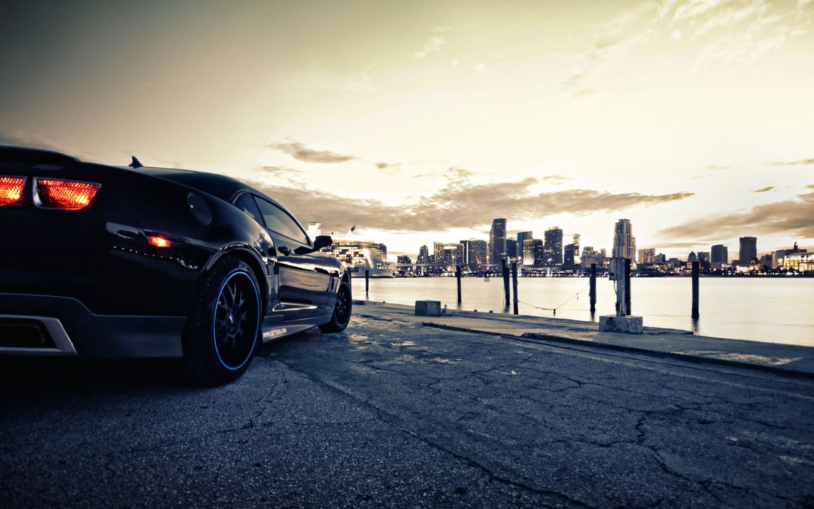 Supercar and city skyline.