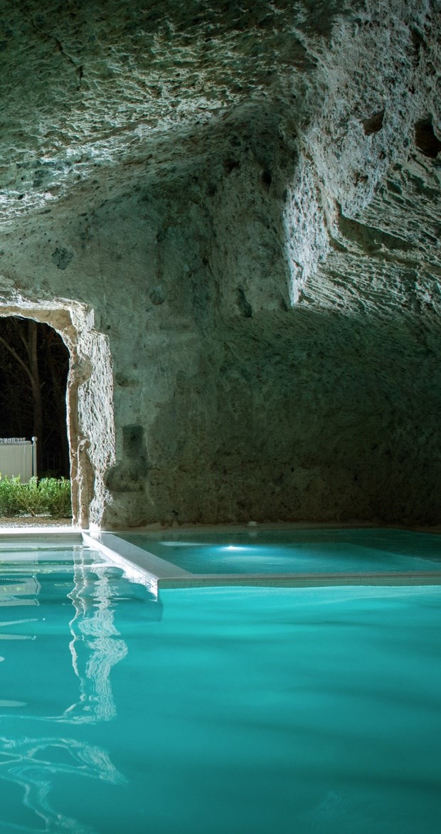 Pool built into a cave by Domus Civita by Studio F.