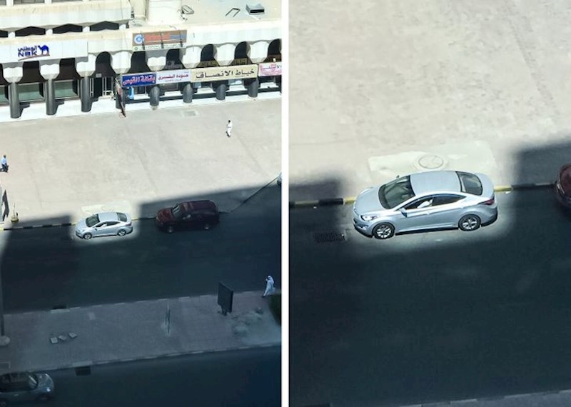 Svjetlo između zgrada obasjava točno jedan auto