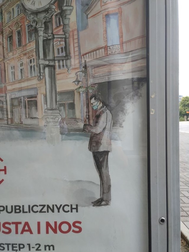 Na plakatu u jednom gradu, osoba na slici ne nosi masku na pravilan način