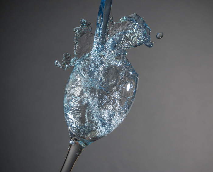 Water splash in glass / blue