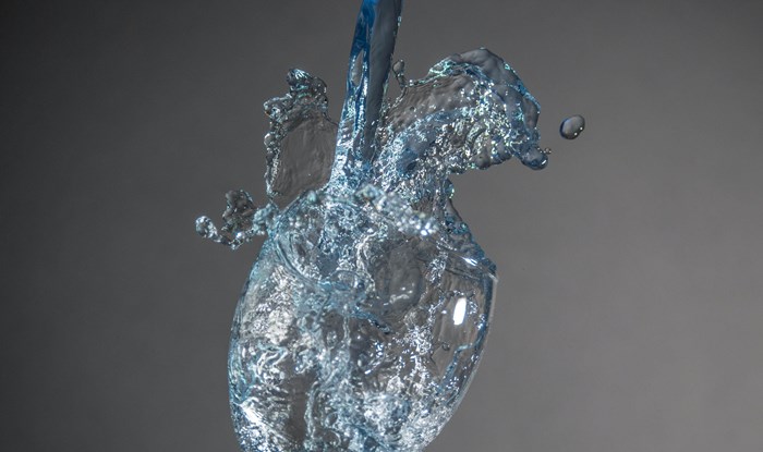 Water splash in glass / blue